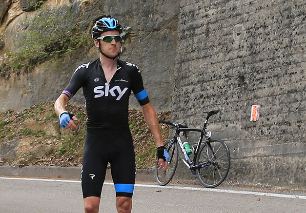 Photo: Not happy: Wiggins is left in the road waiting for a new bike . 