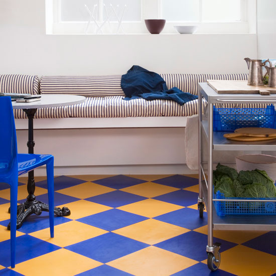 To apply adhesive, you work outwards from one corner of the room